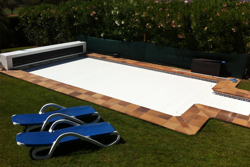 Box slatted pool deck in garden with hammocks