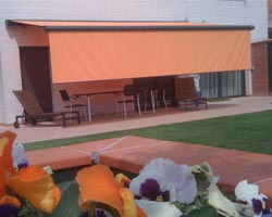 Awning ma6000 orange with front vertical flap in garden