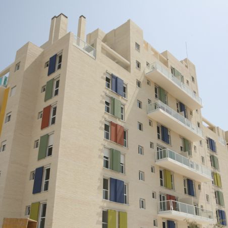 Building with colored i-tensing panels
